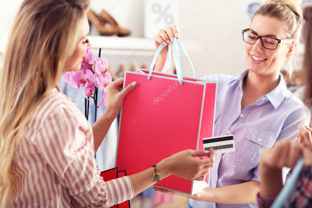 Female customer receiving shopping bags