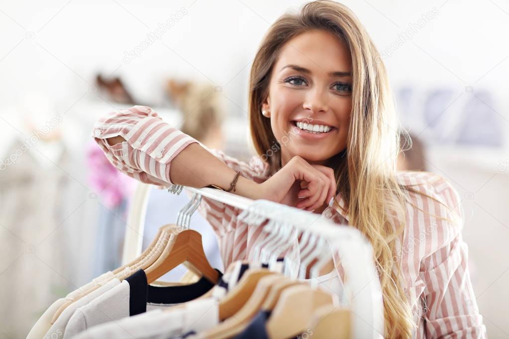 Happy woman shopping for clothes
