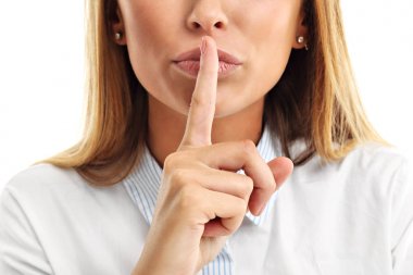 woman holding a finger on her lips clipart