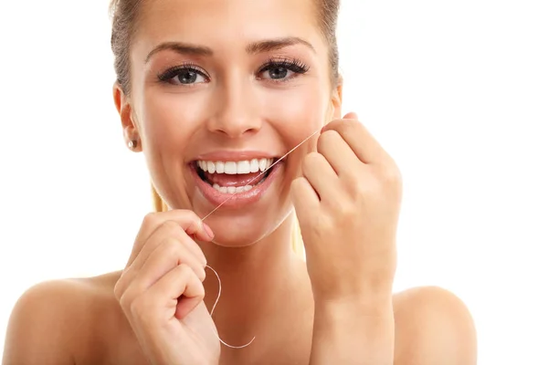 Woman flossing her teeth — Stock Photo, Image