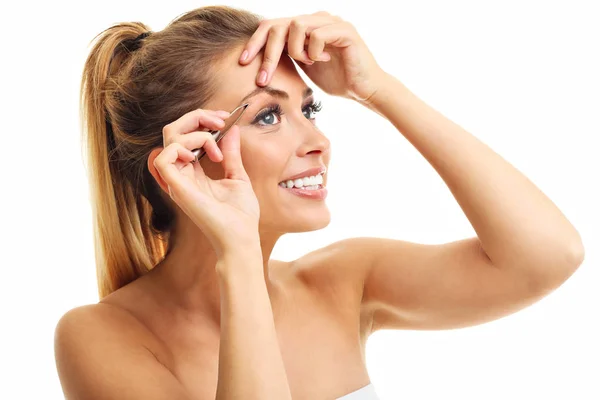 Adult woman using tweezers — Stock Photo, Image