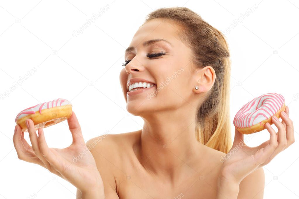 woman posing with donuts