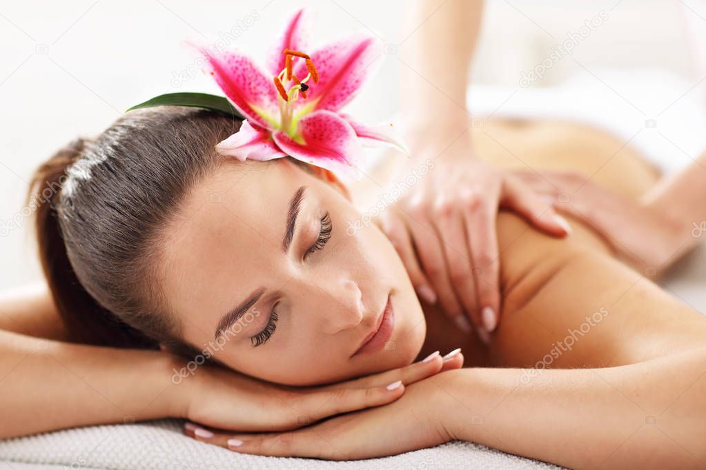  woman getting massage in spa