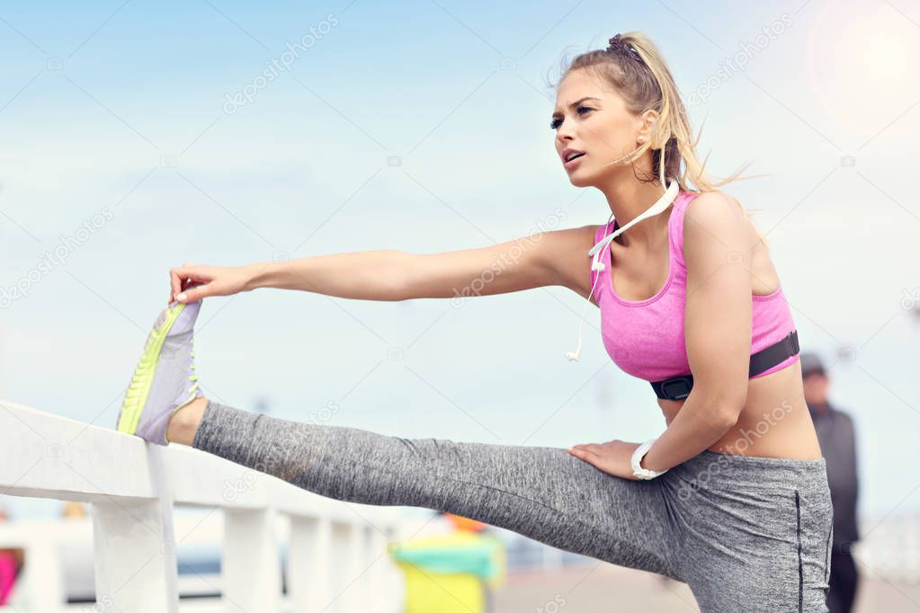 Woman stretching before jogging