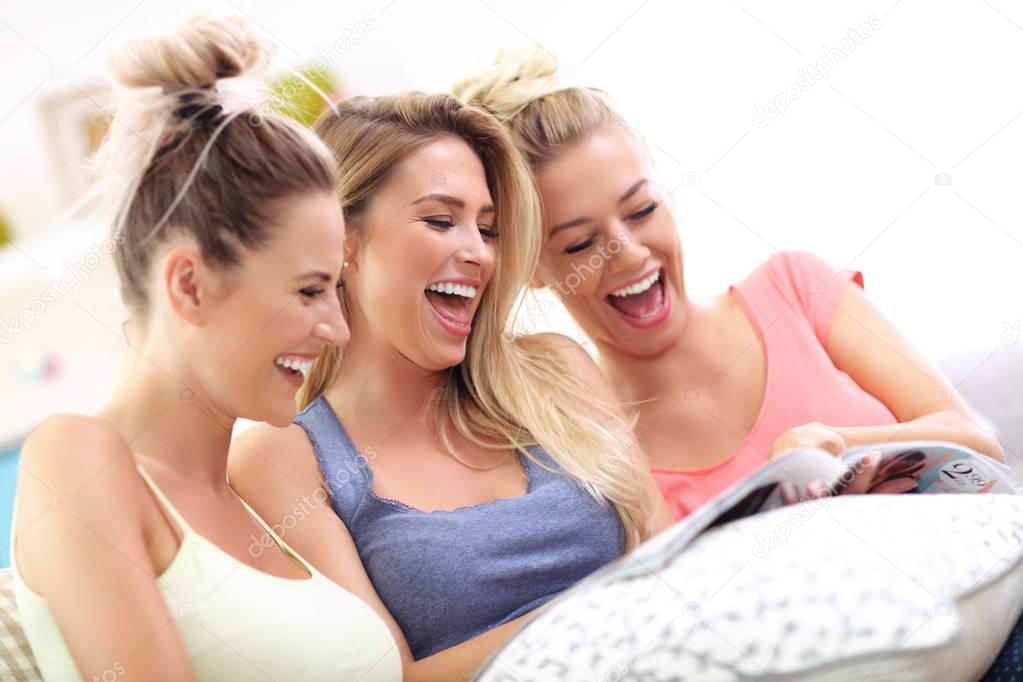 Three beautiful young women chilling at home