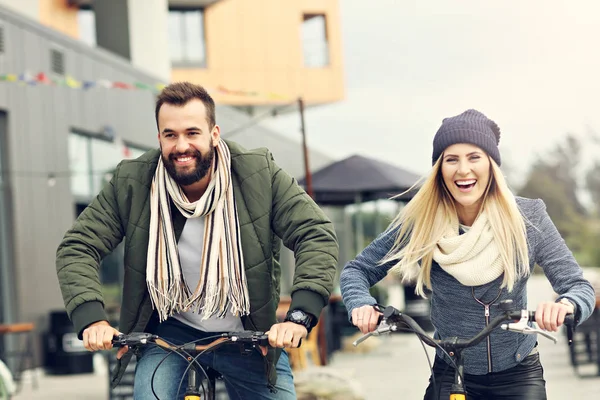 Young couple riding bikes — Stock Photo, Image