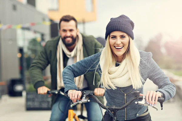 Young couple riding bikes — Stock Photo, Image