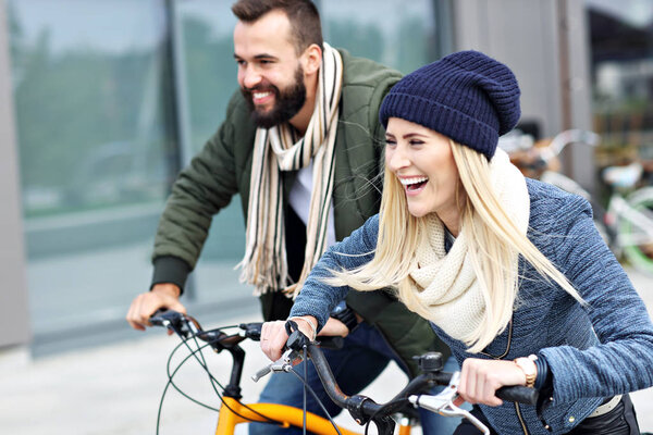  young couple riding bikes