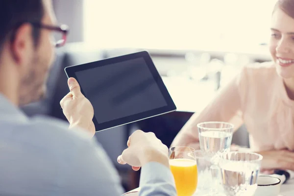 Two Businesspeople Meeting For Lunch In Restaurant