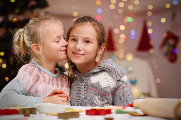 Happy little sisters preparing Christmas biscuits — Stock Photo, Image