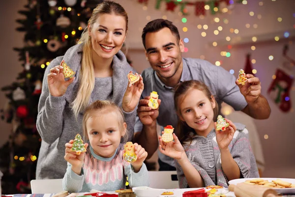 Happy family preparing Christmas biscuits — Stock Photo, Image