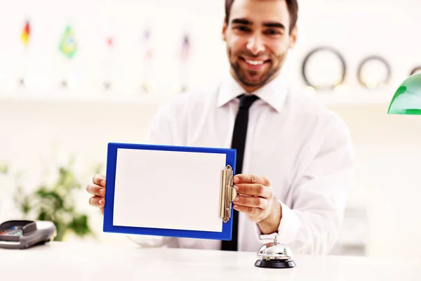 Happy receptionist working in hotel — Stock Photo, Image