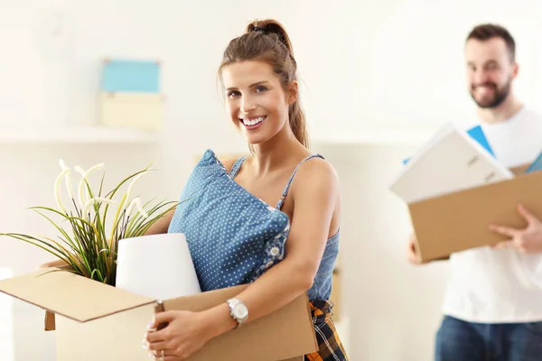 Happy adult couple moving out or in to new home