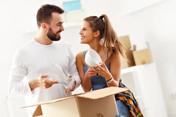 Happy adult couple moving out or in to new home — Stock Photo, Image