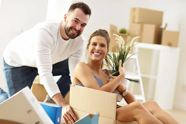 Happy adult couple moving out or in to new home — Stock Photo, Image