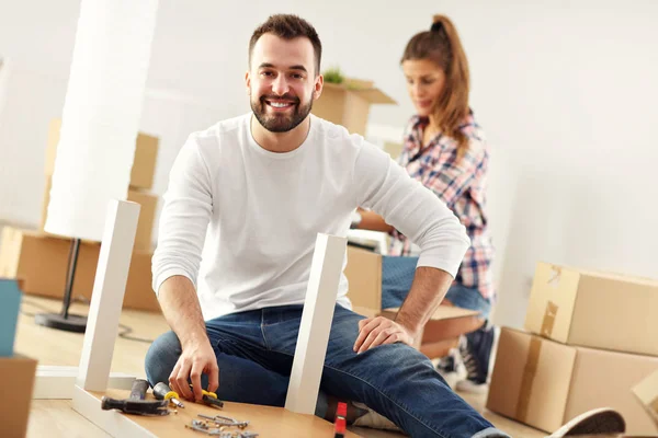 Happy adult couple moving out or in to new home — Stock Photo, Image