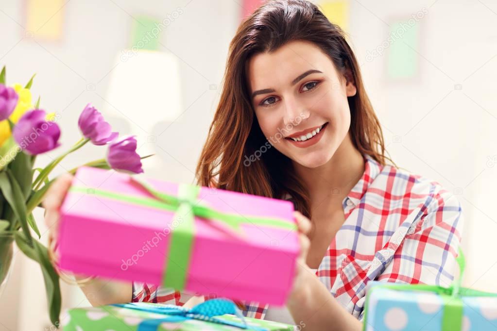 Attractive woman with Easter presents