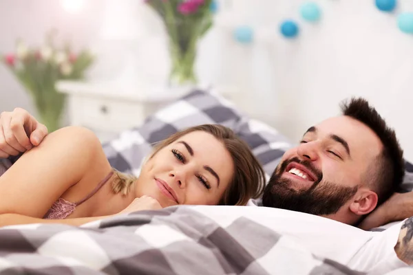 Adult attractive couple in bed — Stock Photo, Image