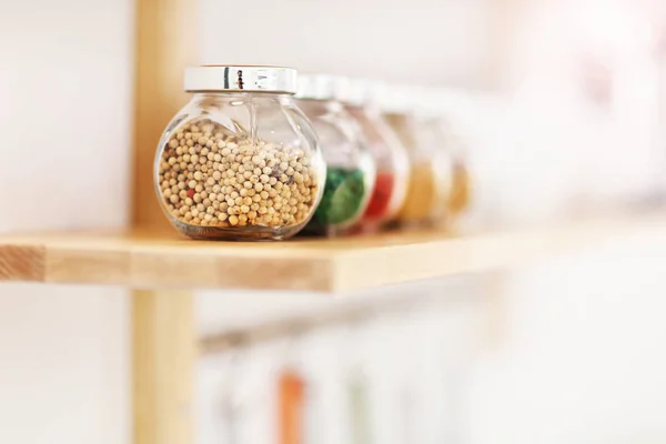 Jars with spices in the kitchen — Stock Photo, Image