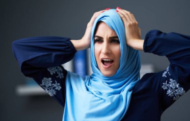 Muslim female student learning at home