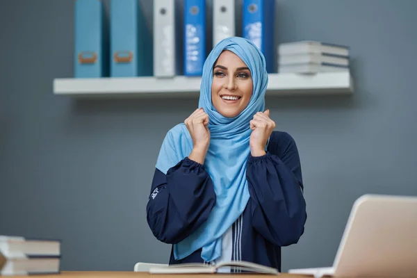 Muslim female student learning at home — Stock Photo, Image