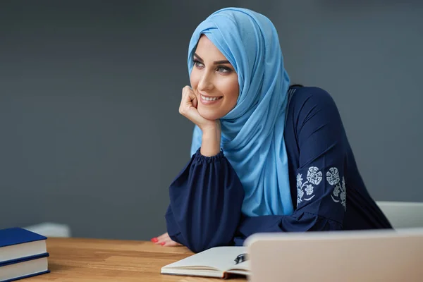 Muslim female student learning at home — Stock Photo, Image