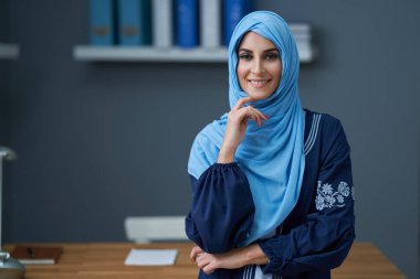 Muslim female student learning at home
