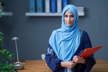 Muslim female student learning at home