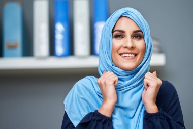 Muslim female student learning at home
