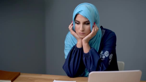 Female muslim student learning at home — Stock Video
