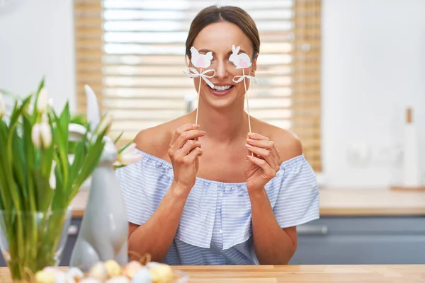 Happy adult woman in Easter mood in the kitchen — Stock Photo, Image