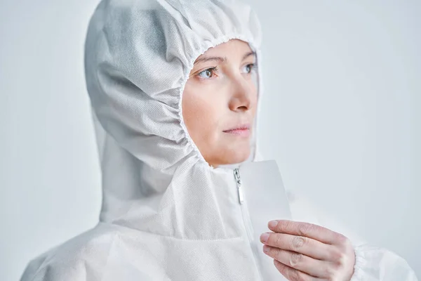 Woman in bio-hazard suit on white background. — Stock Photo, Image