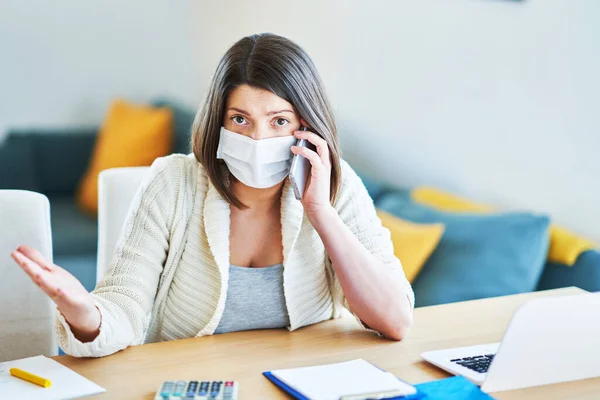 Exhausted woman trying to work at home during coronavirus pandemic — Stock Photo, Image
