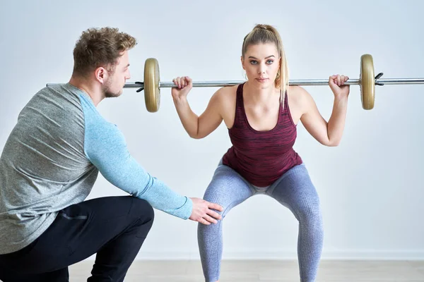 Woman with her personal fitness trainer — Stock Photo, Image