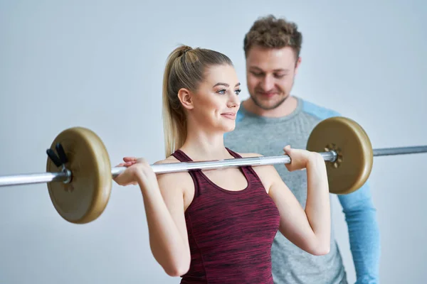Woman with her personal fitness trainer — Stock Photo, Image