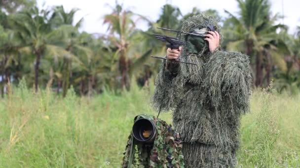 An ornithologist using radio telemetry, tracking to find an bird — Stock Video