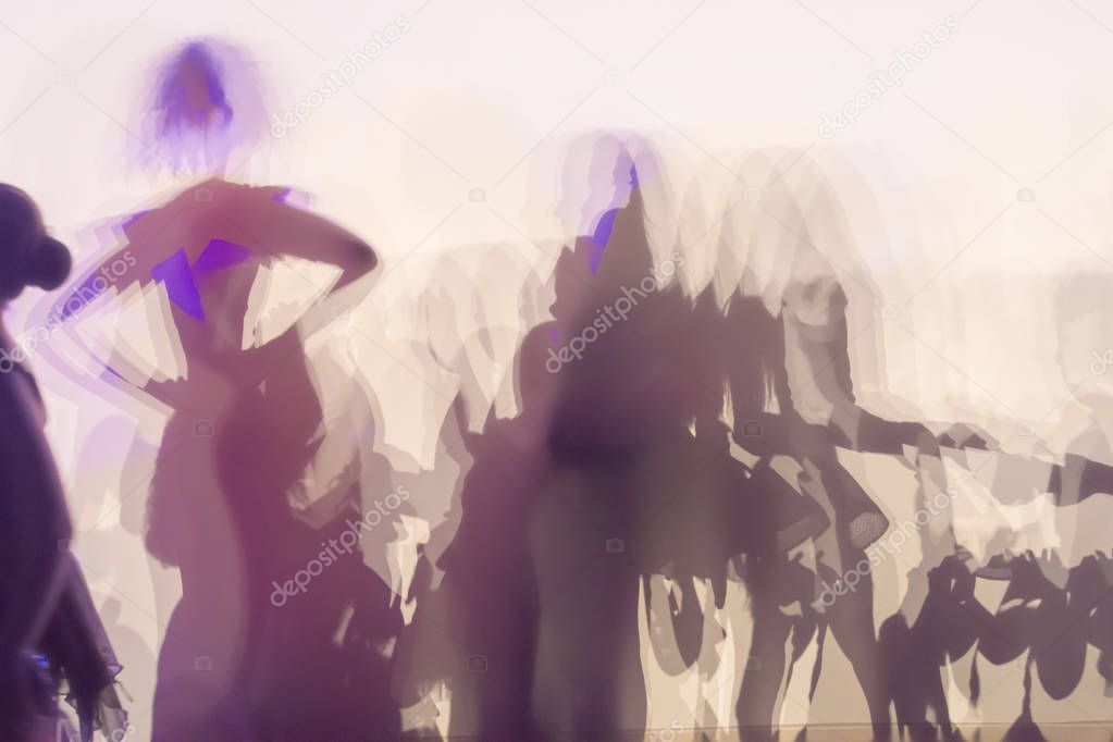 blurred unrecognizable people dancing  