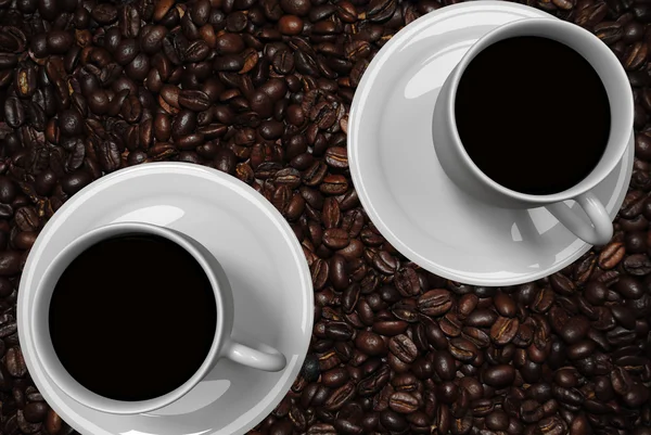 Coffee cup with saucer and a real world picture of roasted coffee — Stock Photo, Image