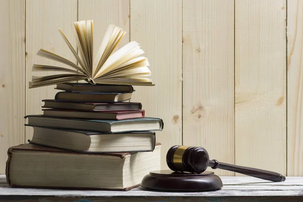 Legal Law concept - Open law book with a wooden judges gavel on table in a courtroom or law enforcement office. Copy space for text — Stock Photo, Image
