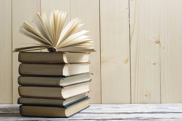 Open book, hardback books on wooden table. Back to school. Copy space — Stock Photo, Image