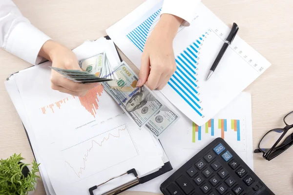 Close up of female accountant or banker making calculations. Savings, finances and economy concept — Stock Photo, Image