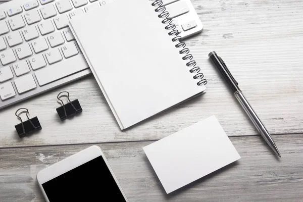 White desk office with laptop, smartphone and other work supplies with cup of coffee. Top view with copy space for input the text. Designer workspace on desk table essential elements on flat lay Royalty Free Stock Photos