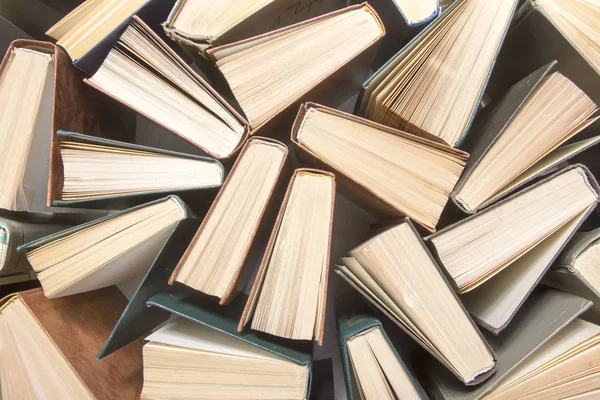 Stack of books background. many books piles.