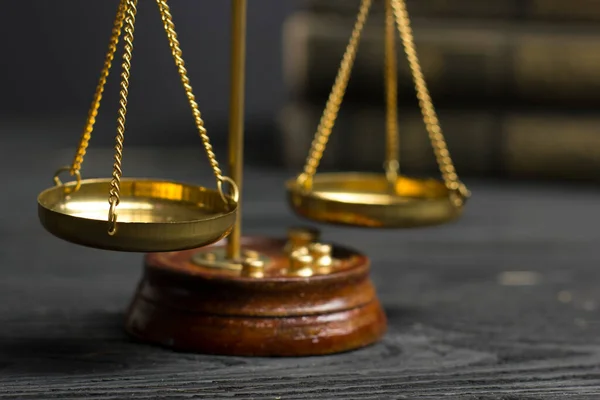 Law concept - Open law book with a wooden judges gavel on table in a courtroom or law enforcement office isolated on white background. Copy space for text