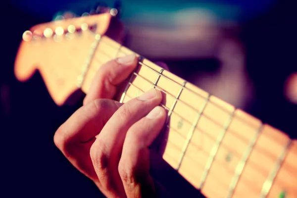 Guitar detail. Playing instrument.Hand and chord — Stock Photo, Image