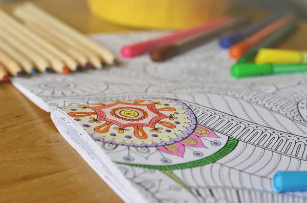 Coloring an adult coloring book — Stock Photo, Image