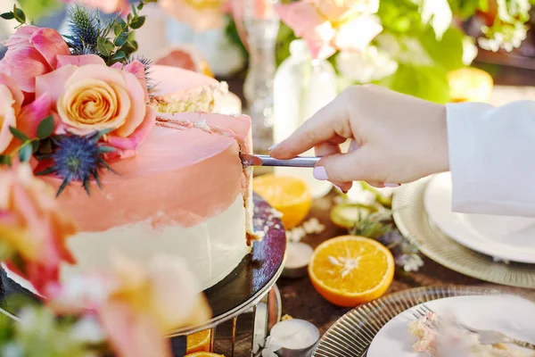 wedding decor on a table with cake, candles and fruits