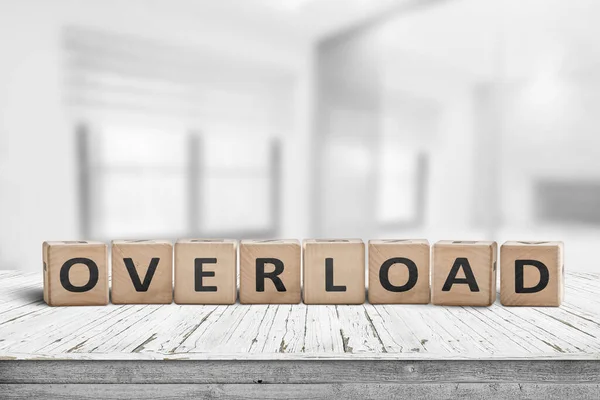 Sign with the word overload in a bright office — Stock Photo, Image