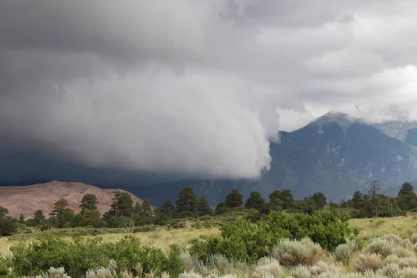 Storm rolls in over sand dunes — Stock Photo, Image