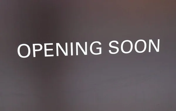 Opening soon sign on store wall — Stock Photo, Image